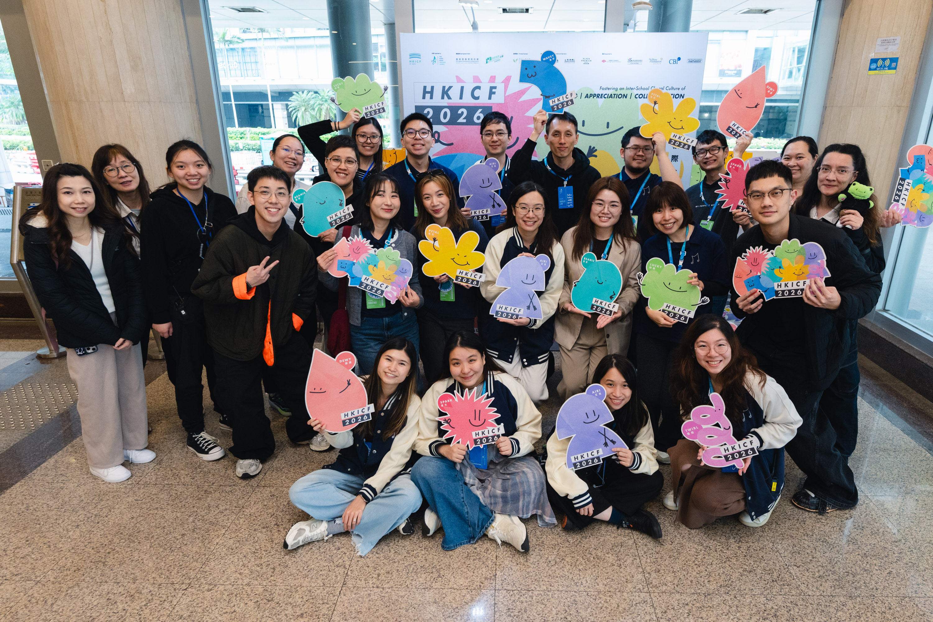 HKICF 2026 event team posing together with colourful flower props